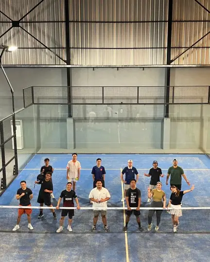 A group on a padel court